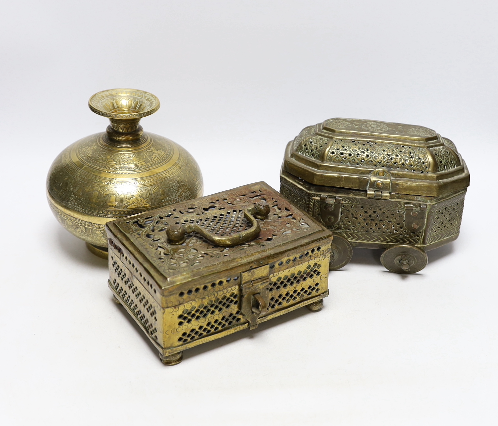 Eastern brassware to include a betel box on wheels, a vase with engraved detail and a pierced box, tallest 15.5cm (3)